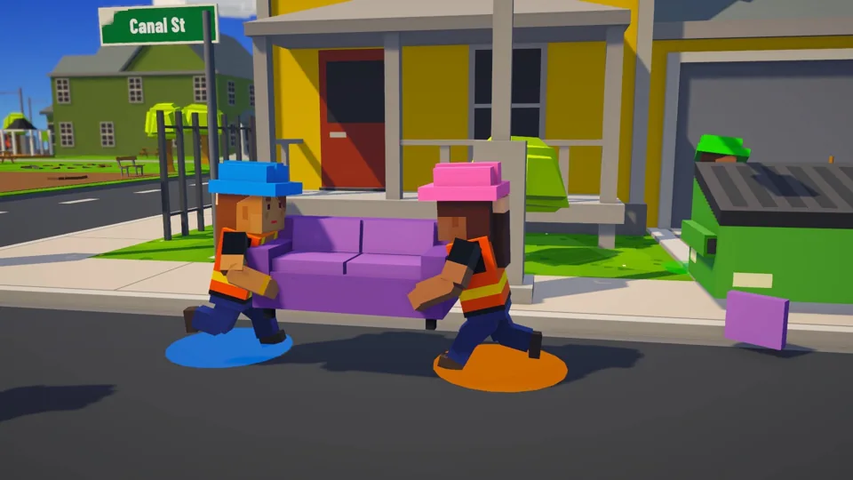 Two public works crew members carrying a purple couch together on Canal Street